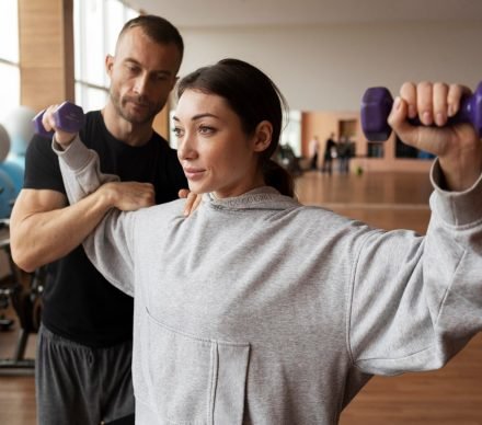 patient-doing-physical-rehabilitation-helped-by-therapists-scaled.jpg